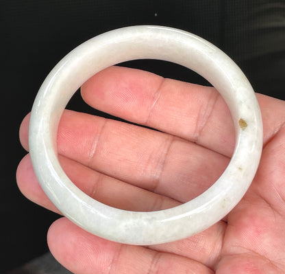 Flat inner and round outer edges of 57.4mm icy milky white, light yellow, and honey Burmese jade bangle JB805