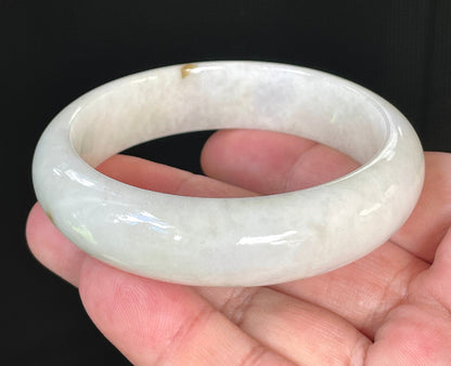 Flat inner and round outer edges of 57.4mm icy milky white, light yellow, and honey Burmese jade bangle JB805