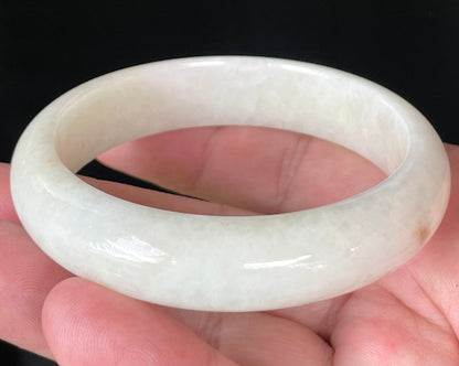 Flat inner and round outer edges of 59mm icy milky white, light yellow, and honey Burmese jade bangle JB928
