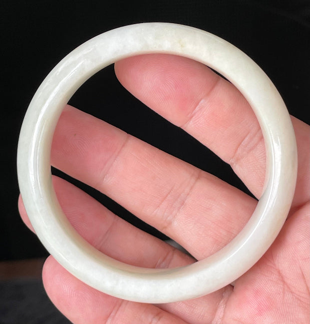 Flat inner and round outer edges of 59mm icy milky white, light yellow, and honey Burmese jade bangle JB928