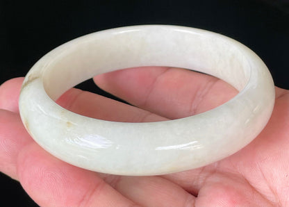 Flat inner and round outer edges of 59mm icy milky white, light yellow, and honey Burmese jade bangle JB928